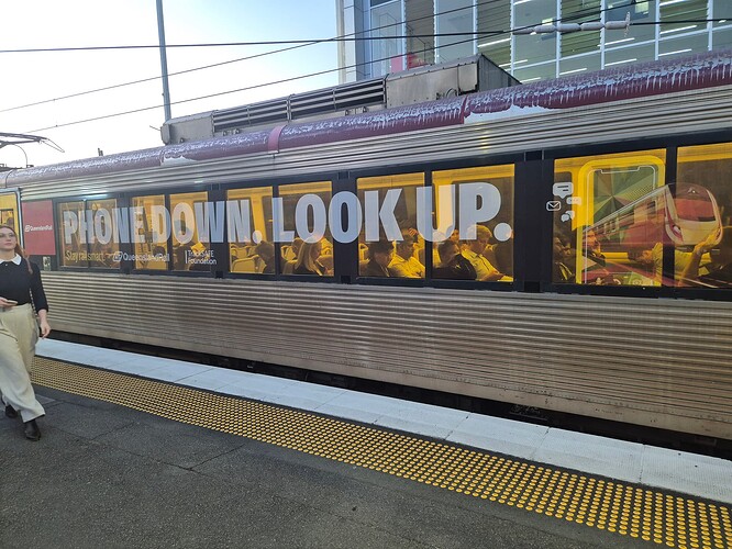 Queensland Rail Train with 'Phone Down, Look Up' decal